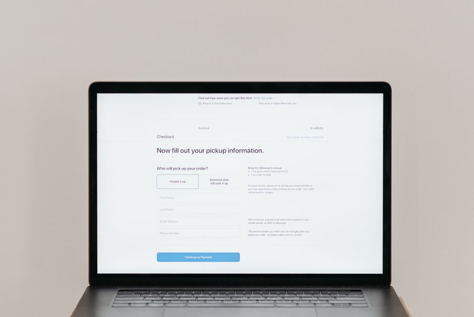A laptop displaying an online checkout form, highlighting technology and e-commerce.
